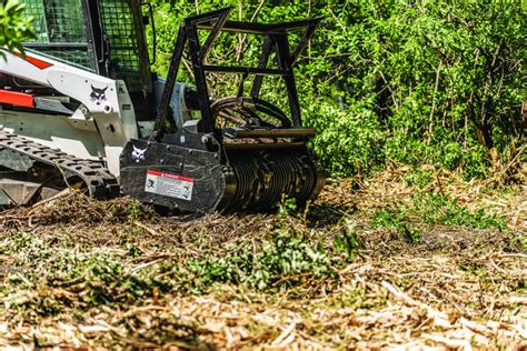 bobcat skid steer clearing land|bobcat attachments for clearing brush.